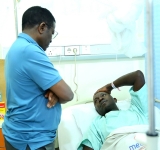Katikkiro visits Kabaka’s guard, Afande Orech Francis, at Medipal hospital in Kololo